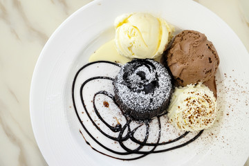 Chocolate lava cake with ice-cream in the dish