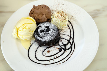 Chocolate lava cake with ice-cream in the dish