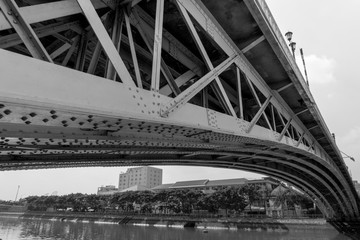 Steel construction from under the bridge. Black and white
