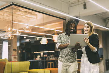 Coworkers talking in a modern office