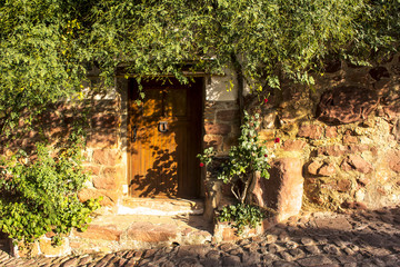 The door to the old  house and cobblestones