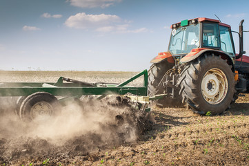 Fototapeta premium Tractor plowing
