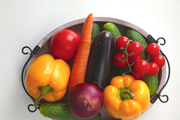 Fresh autumn vegetables on a white background