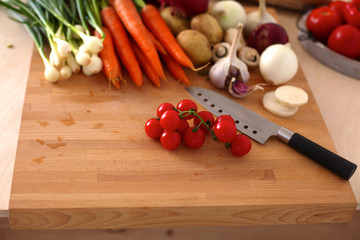 Pile of organic vegetables on a wooden table
