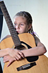 young teenage girl with guitar