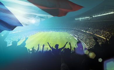 crowded football stadium with french flag - 92129373