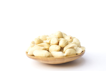 groundnuts on wooden spoon isolated on white background