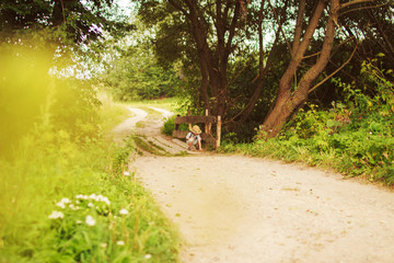 boy in the forest on footpath
