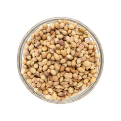 Top view of Organic  Dried coriander seeds (Coriandrum sativum) in glass bowl isolated on white background.