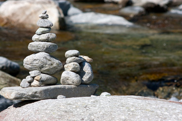 Stone in balance near a river