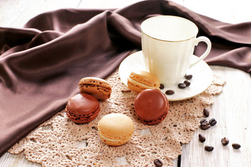 Porcelain cup with macaroons on lace