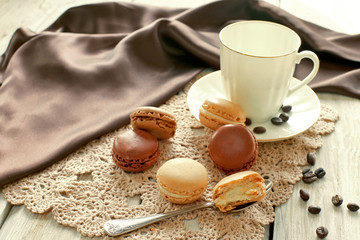 Porcelain cup with macaroons on lace