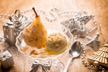 ice cream and pear over christmas table, selective focus