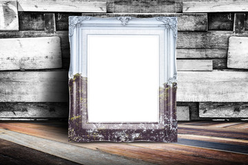Blank nature overlay vintage photo frame leaning at plank wood w