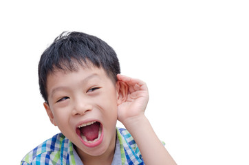 Young Asian boy cupping hand behind ear on white background