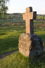 Ancient stone cross on the hill Savkina
