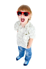 Full body Young cute little boy shouts with red sunglasses and one hand in pocket of jeans, Isolated on white background, Positive human emotion, facial expression © kulniz