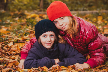 Sisters playing with leaves