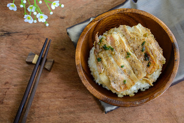 Salt and black pepper grilled pork with Japanese Rice in wooden