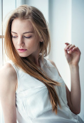 Fototapeta premium Young woman portrait. Shape and fit body beauty studio shoot