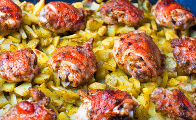 Big pan of roasted chicken with potatoes