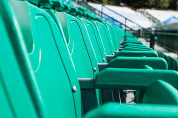 green plastic seat on stadium