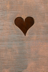Heart carved on a wooden board