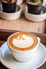 cappuccino coffee on wood table