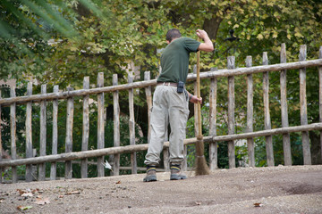 937 - man cleaning the cages at the zoo