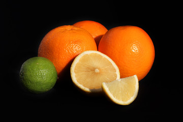 Citrus on black background