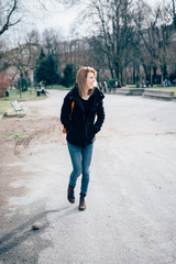 Fototapeta premium young beautiful hipster sporty blonde woman walking in the city,
