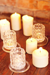 scented candles on old wooden background