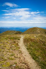 Fototapeta na wymiar Walking track on ridge of Mt Feathertop, 2nd highest peak in Victorian Alps, Australia