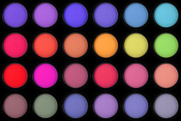 colorful eyeshadows in black boxes on black