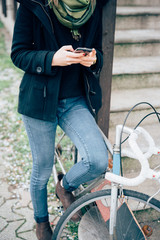 Naklejka premium young beautiful hipster sporty blonde woman in town leaning on a