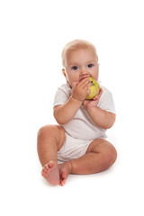 baby with an apple  on a white background