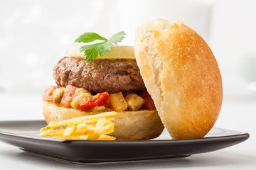 Pljeskavica, a hamburger with vegetables typical from Serbia