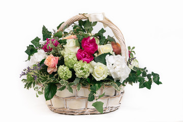 gift basket of flowers whith roses peonies hydrangea isolated