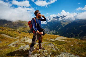 hiker at the top of a pass