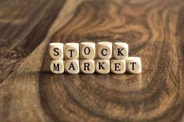 Word STOCK MARKET on wooden cubes