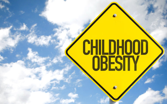 Childhood Obesity sign with sky background
