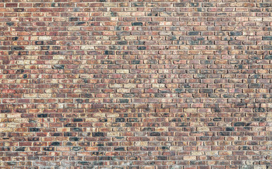 A brick wall made from red bricks