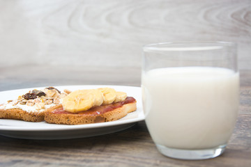 Milk and toast with bananas and cereals