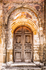 Fototapeta premium Old closed door with highly textured doorway