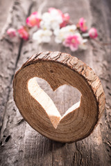 Light  heart on rustic wooden background