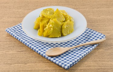 Stir Fried Pumpkin with Egg in A White Dish