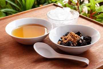 Grass jelly dessert, herbal gelatin, Chinese style.