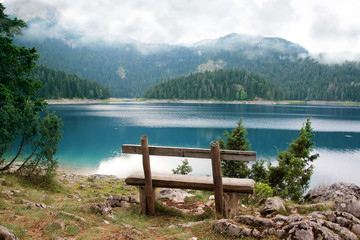 Naklejka na ściany i meble Relax. Rest near lake. Bench near lake. Beautiful mystical lake. Black Lake, Durmitor National Park. Montenegro
