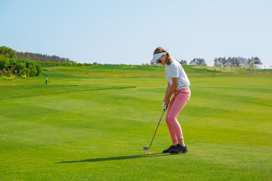 Girl playing golf