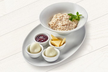 English breakfast with porridge and hard-boiled eggs